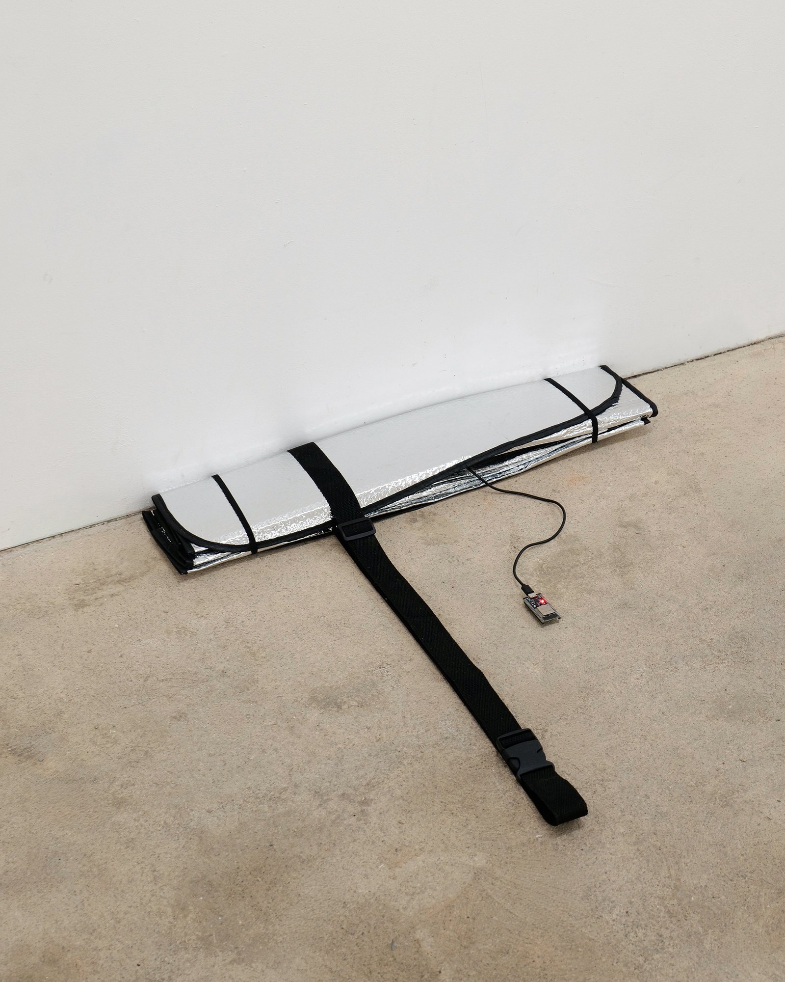 Francesco Muggetti, Untitled, contemporary art installation, unreadymades, infrastructural interventions, contemporary artist, microintimacy, traces, car sunshade, esp32, morse code, domestic