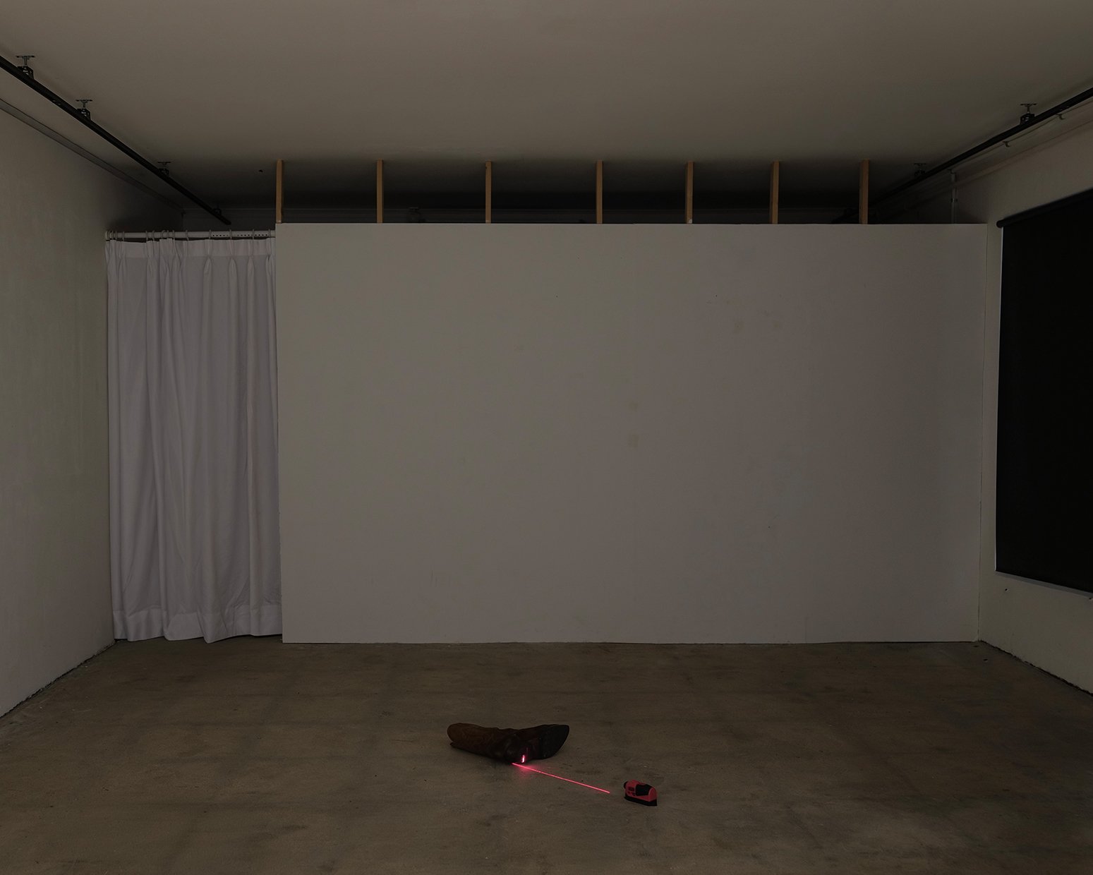 Francesco Muggetti, Untitled, contemporary art installation, unreadymades, infrastructural interventions, contemporary artist, microintimacy, traces, western boot, laser level, domestic