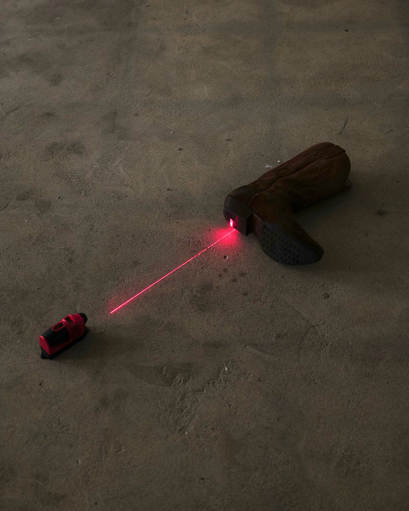 Francesco Muggetti, Untitled, contemporary art installation, unreadymades, infrastructural interventions, contemporary artist, microintimacy, traces, western boot, laser level, domestic